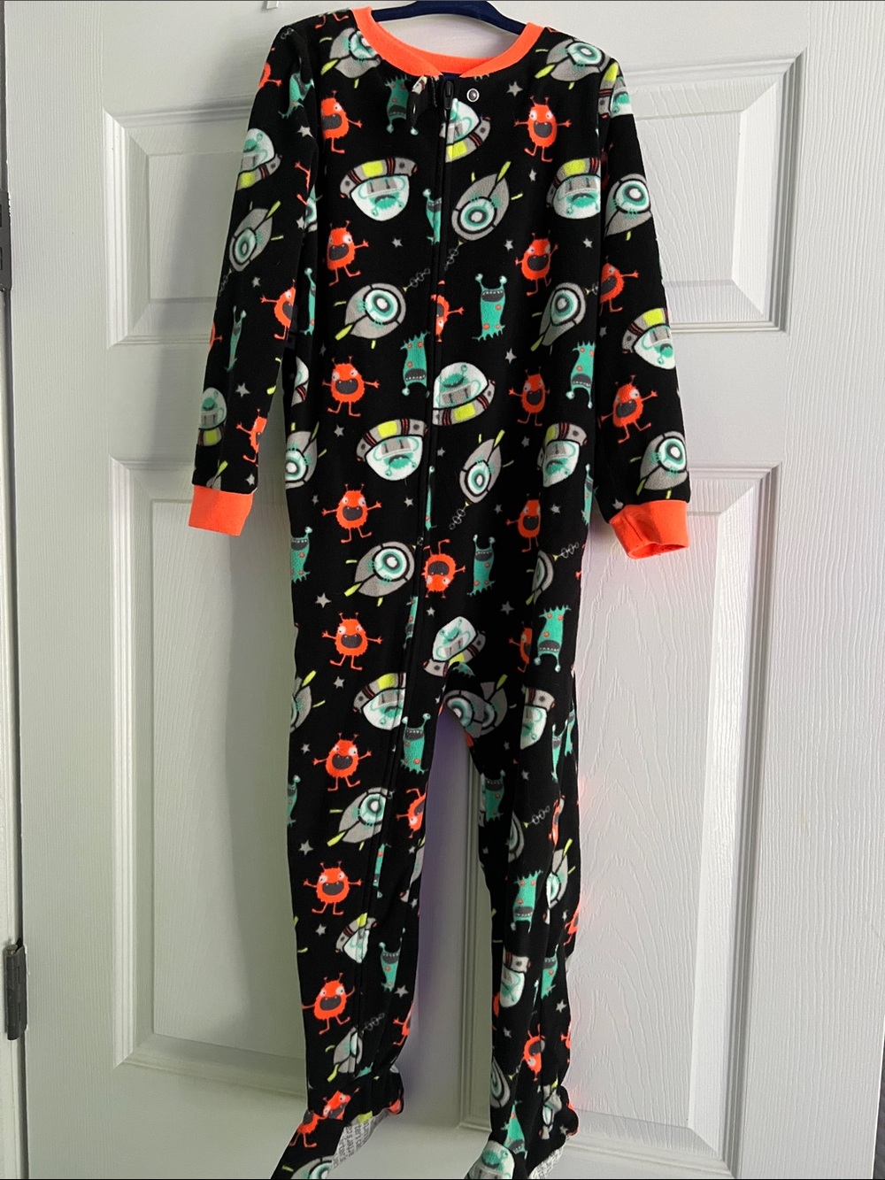 Black Space Monster Footed Pajamas with Neon Orange Trim